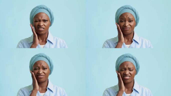 不幸的非洲裔美国女性在蓝色背景上牙痛
