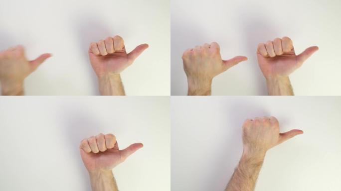 向上和向下拇指。白色背景上男性白人手的俯视图。显示方向右或左，向上和向下。手势。握紧拳头，展示课堂或
