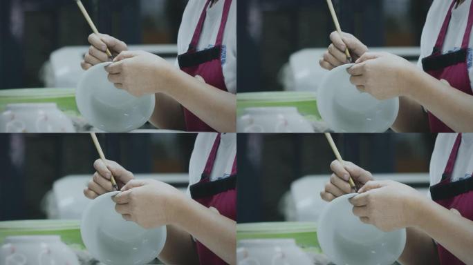 慢动作，大师画家在陶瓷碗上画画