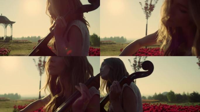 女人在阳光下的夏日公园演奏大提琴。年轻艺术家在户外排练