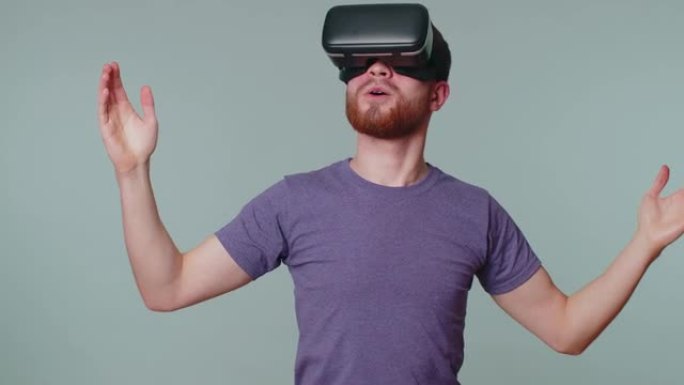 男子使用虚拟现实未来技术VR耳机头盔玩模拟3D视频游戏