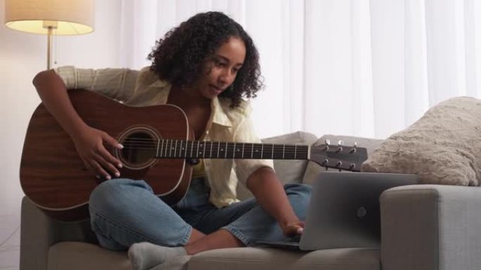 在线吉他课音乐教育女性笔记本电脑