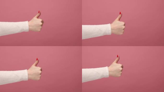 女人的手表示喜欢或竖起大拇指，批准标志，对服务满意，反馈良好。