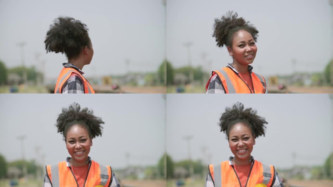 非洲工程师女人对着镜头微笑。