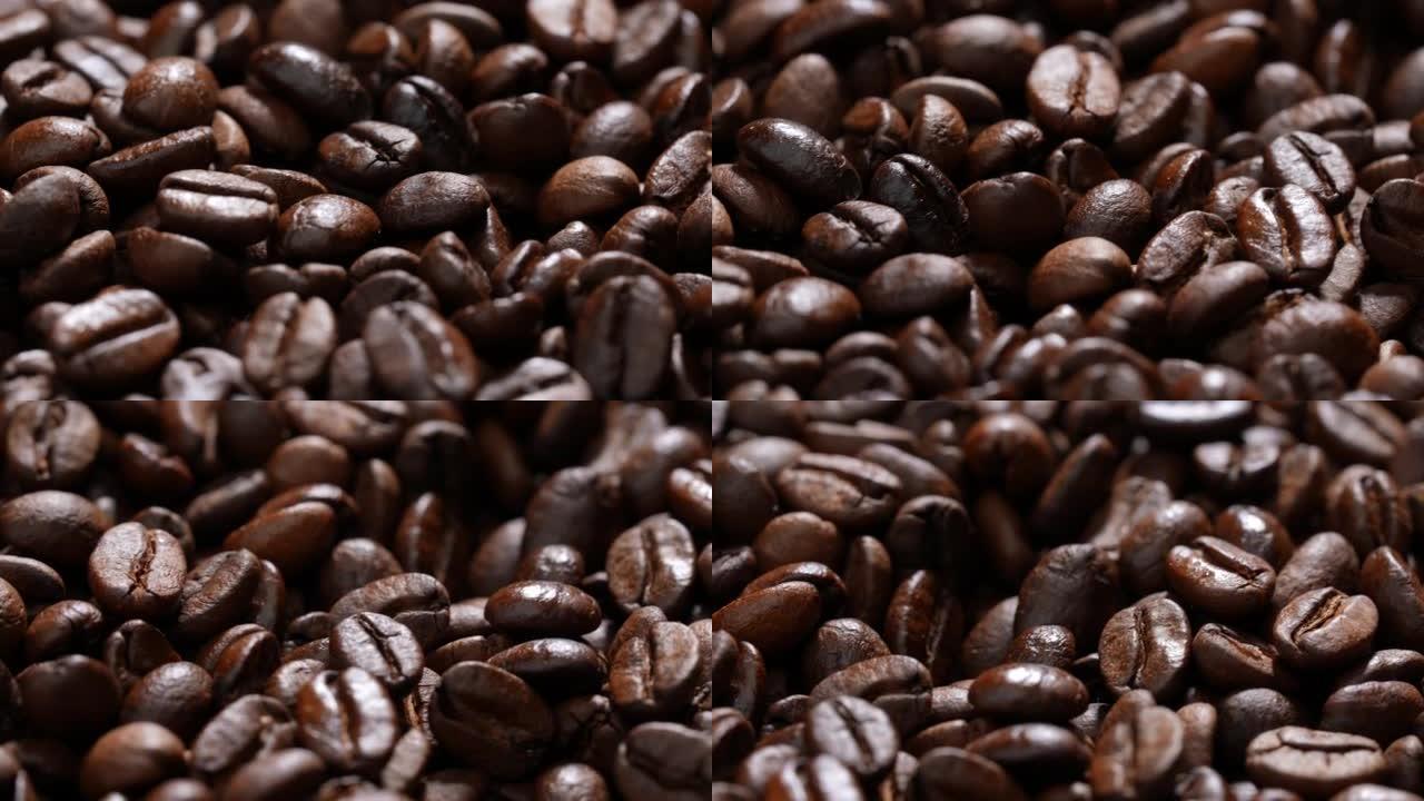 一堆烤咖啡豆。一大堆新鲜烘焙的浓郁芳香咖啡豆。慢动作。