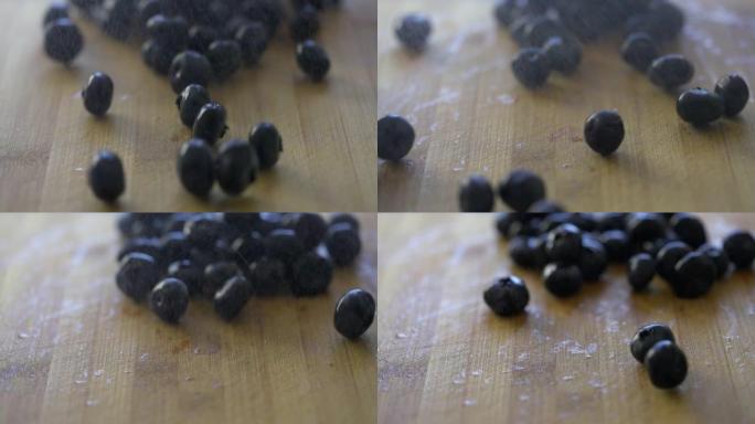 成熟的蓝莓在切菜板上滚动