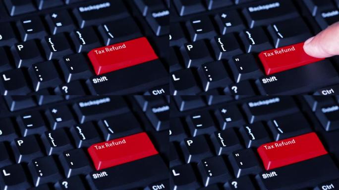 男性手指在电脑键盘上按下带有退税文本的红色按钮