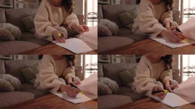 一个成年妇女正在家里学习。