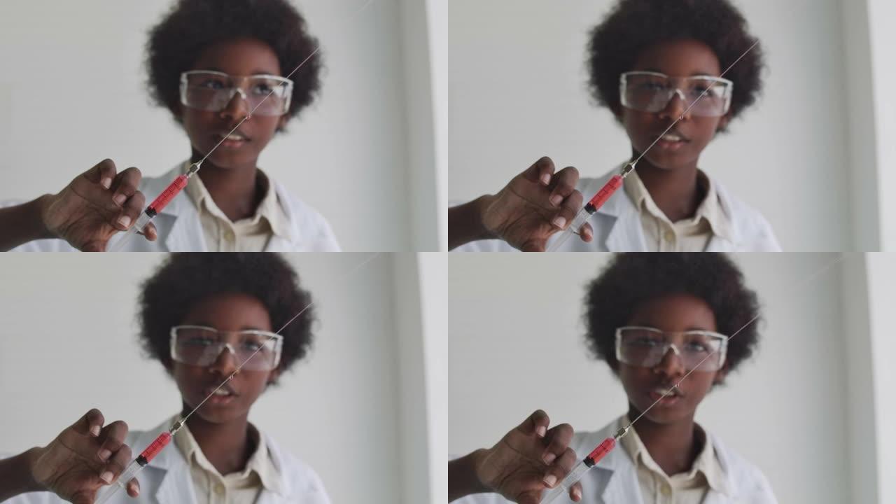 黑人男孩拿着注射器，从注射器中喷出透明液体。