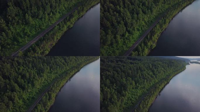 日出无人机镜头时，叶尼塞河河岸的铁路鸟瞰图