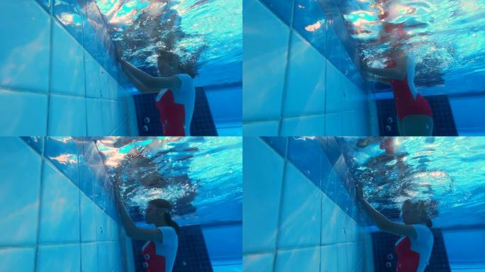 女人在水下呼吸，家庭视频风格拍摄，跟随凸轮。