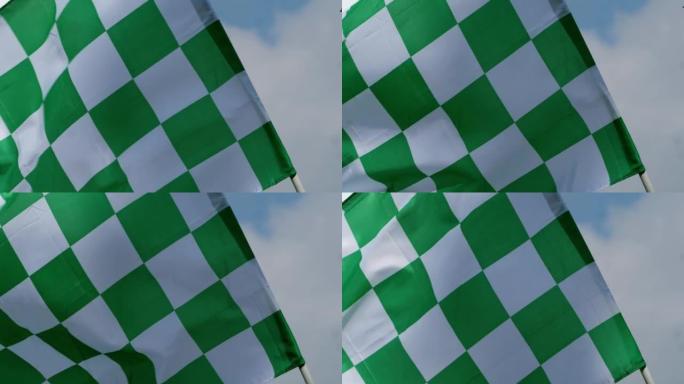 绿色方格的竞赛旗在风中飘扬