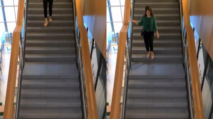 女学生在大学校园内走下楼梯