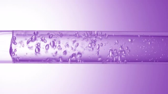 透明液体在玻璃管中流动，产生气泡