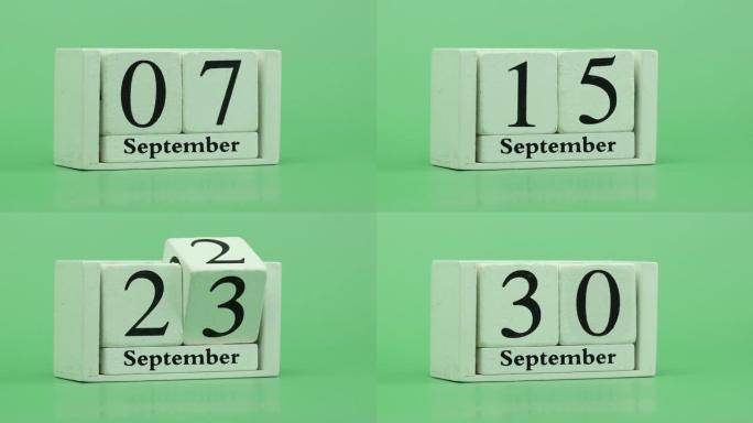9月月份日历4k停止运动通过手工木制日历在一个月内快速的时间节奏，日期月份和日期放在木桌上