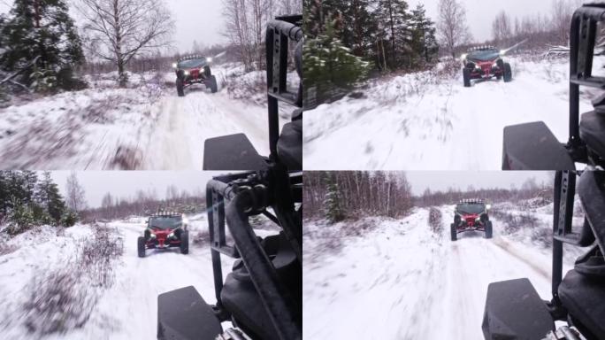 白雪皑皑的道路和一群极端的越野车骑着穿越冬季森林。