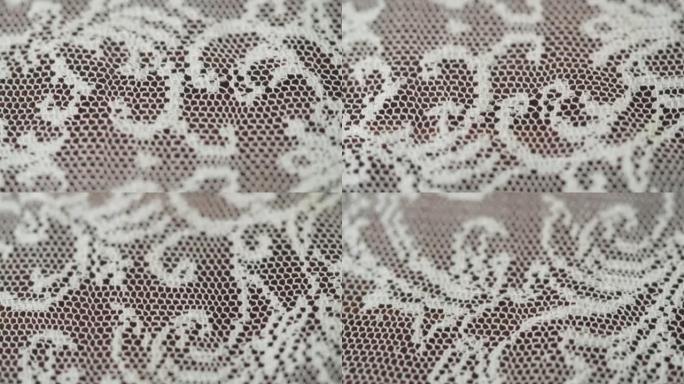 蕾丝白色面料特写。婚纱用布料质地。吉普雷的微距拍摄。针线活和定制。