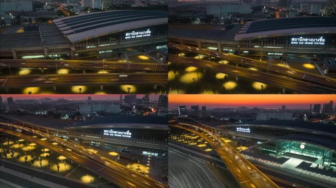 空中无人机超延时日落场景邦苏大站高速公路上有交通车灯，邦苏大站是泰国曼谷一个新的铁路枢纽，有快速列车