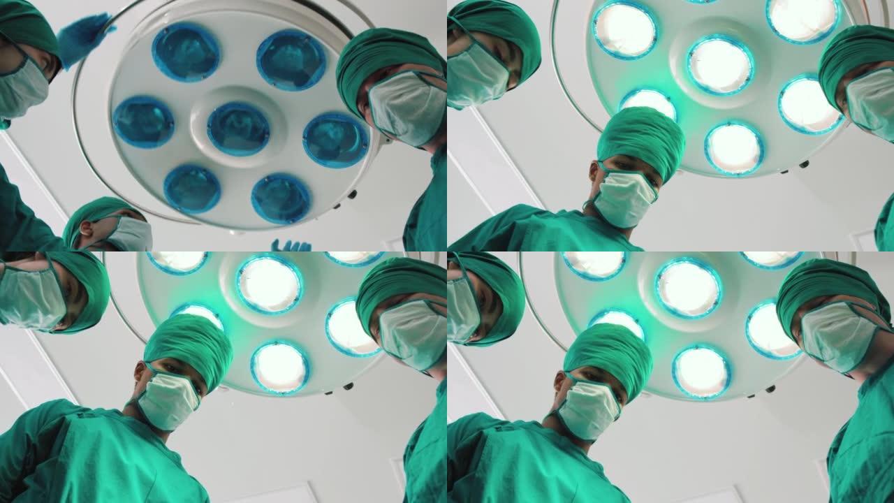 两名专业外科医生打开手术灯的4k录像