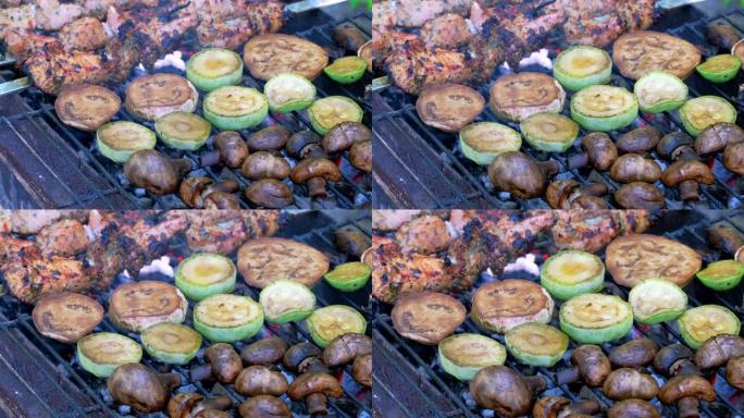 烤肉串在户外用金属串蔬菜烹饪。传统的东方菜肴腌制烧烤肉在木炭和火焰上烧烤炉上煮熟。烤猪肉、羊肉、烤肉