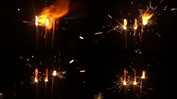 黑色工作室背景上的火花点火和燃烧。闪闪发光的孟加拉烟花，在黑暗中闪烁着金色的火花。概念假期，新年，派