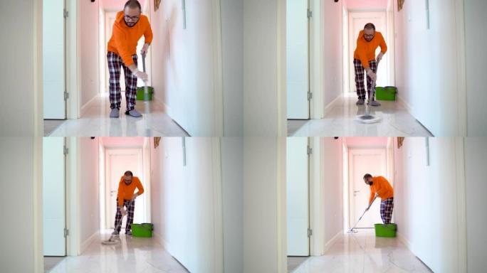 一个年轻人帮助他的妻子打扫他的房子。