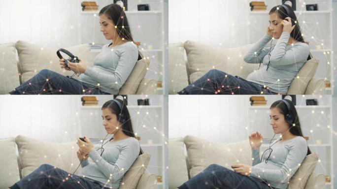 4k孕妇用神经丛粒子听音乐的慢动作视频。