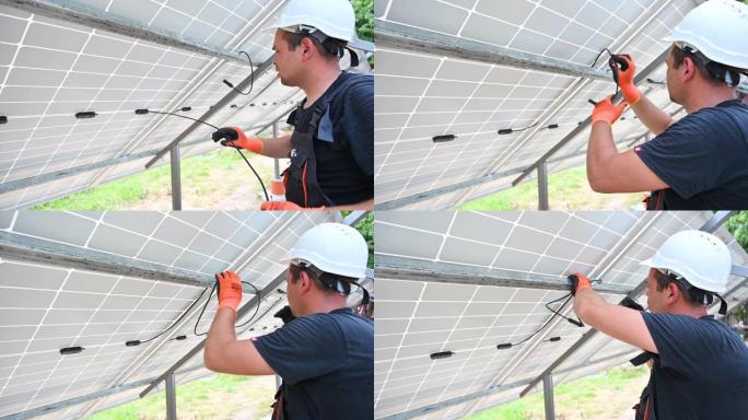 安装光伏太阳能电池板的男性太阳能技术员。