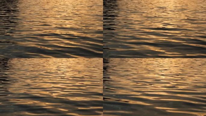 在日落时间航行时，关闭池塘里的波浪波浪
