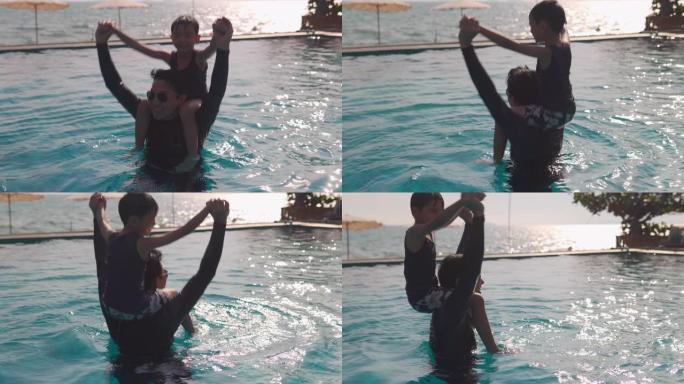快乐的亚洲家庭: 亚洲男孩骑着父亲的脖子 .. 爸爸和男孩一起在游泳池里玩耍