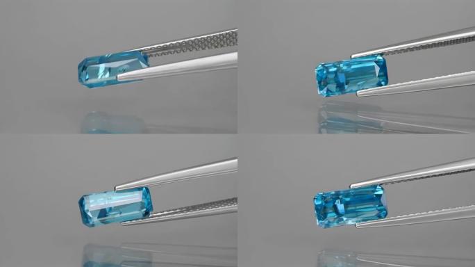 镊子中切割的天然宝石蓝色锆石八角形