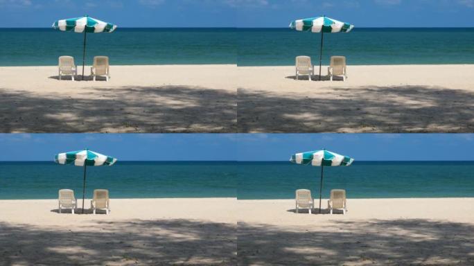 夏季岛上的海滩旅游区沙滩两把椅子春天炎热
