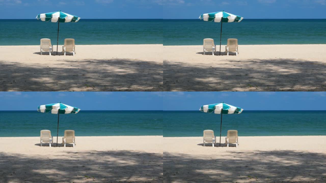 夏季岛上的海滩旅游区沙滩两把椅子春天炎热
