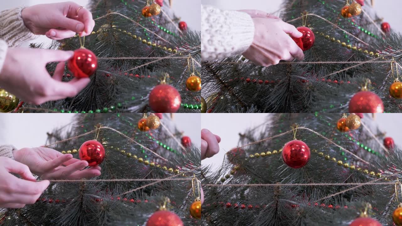 女性手用新年圣诞装饰品装饰圣诞树。缩放