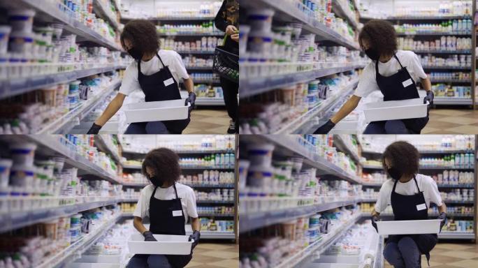 女工在超市牛奶部门的货架上摆放产品，慢动作