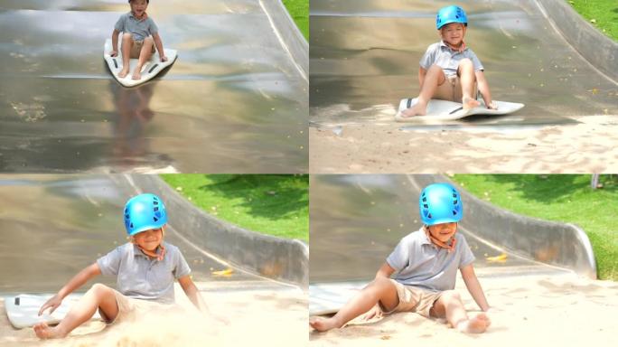 亚洲小子在户外操场玩秋千、跷跷板和活动。户外学习、发现和幸福的概念