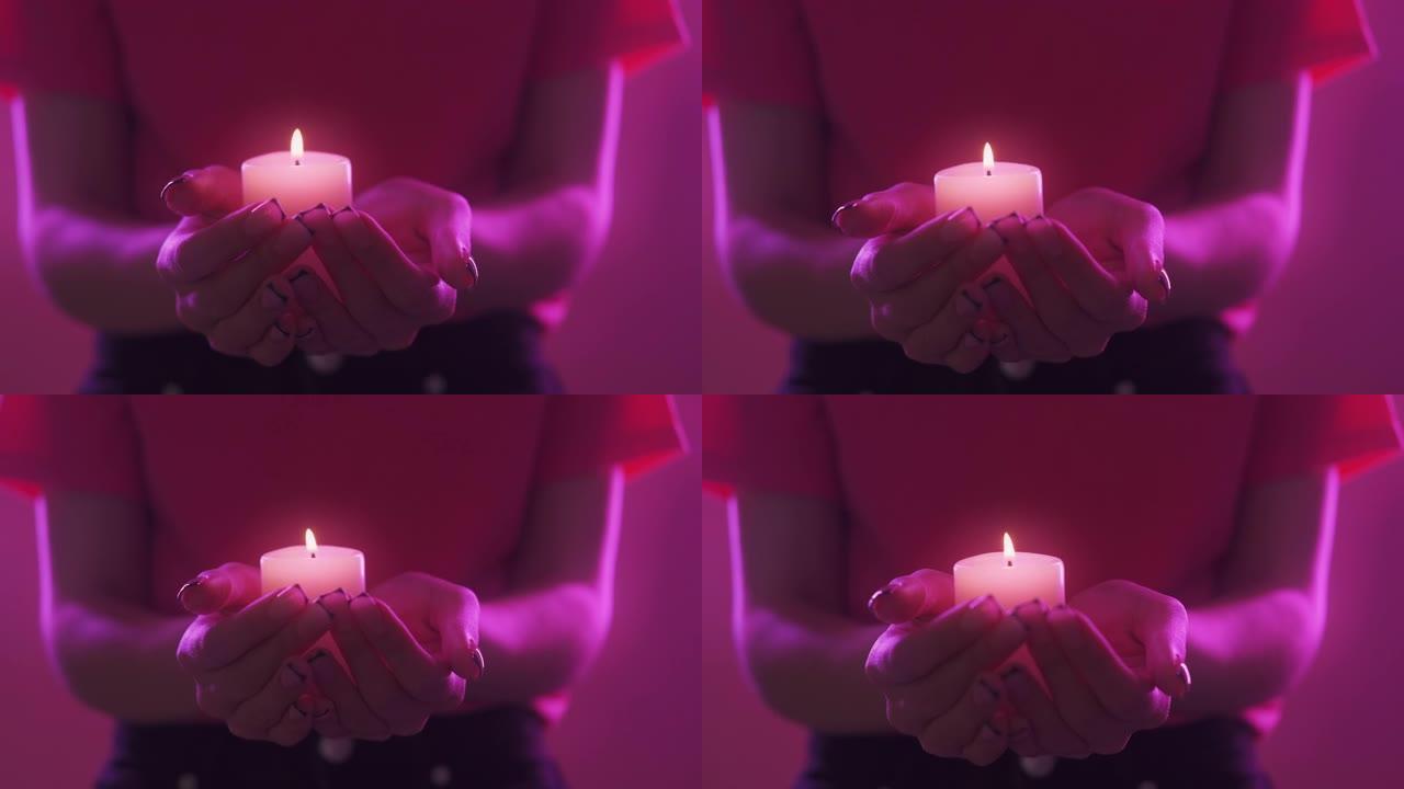 蜡烛冥想所有圣徒日女人手轻