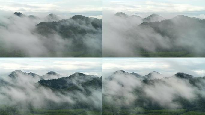 泰国宋卡府纳塔韦市宽隆山，晨间美景金光日出和薄雾在高山上流动