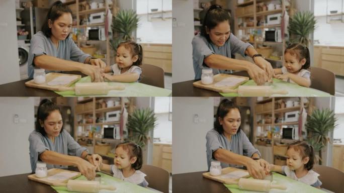 亚洲家庭周末活动，妈妈和女儿喜欢自制饺子饺子。