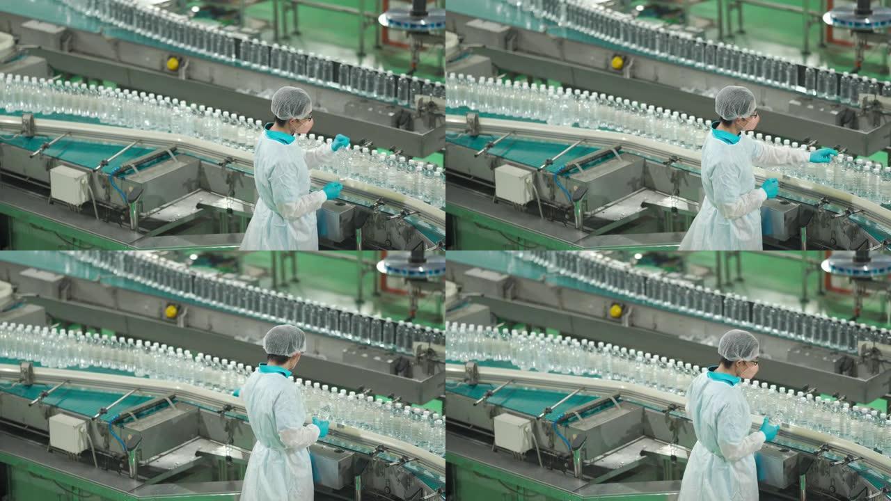亚洲华人水厂生产线女工，携带个人防护用品，日常检查水瓶工作