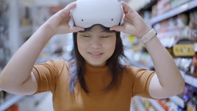 令人兴奋的亚洲女性佩戴vr耳机获得体验使用VR-耳机眼镜走过虚拟百货商场的metaverse，亚洲女