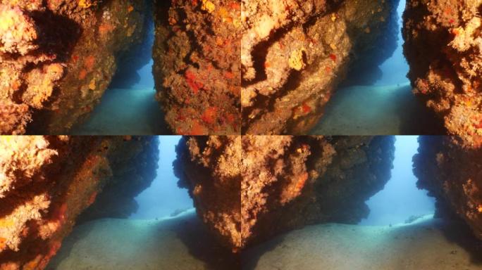 太阳光线太阳光束和太阳在洞穴中照耀水下海洋水肺潜水员在洞穴背景中看到美丽的光景