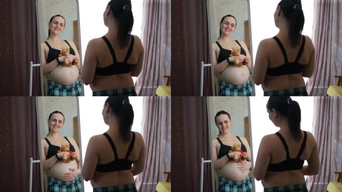 孕妇在镜子前摸肚子