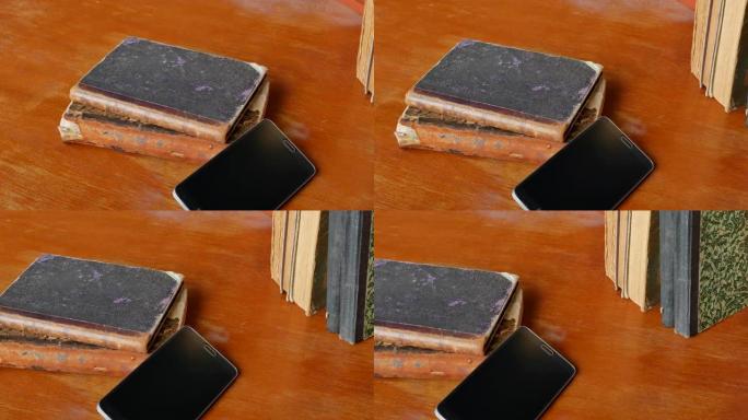 老桌上的旧智能手机和稀有古董书籍-4K，锅