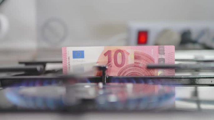 燃气燃烧器和背景10欧元纸币被拉出。天然气价格急剧上涨的概念