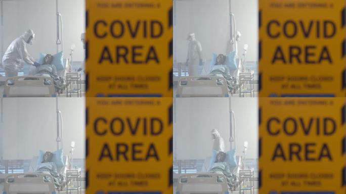 医生给医院检疫区的新型冠状病毒肺炎病人戴上氧气面罩
