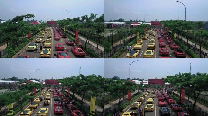 印度尼西亚南坦格朗。2017年5月03日: 红色和黄色的道路上排队的昂贵跑车的鸟瞰图。以4k分辨率拍