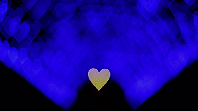 情人节4K UHD视频背景。在黑暗的背景上与浪漫闪耀蓝色心的波克接壤。爱，心状的波克。