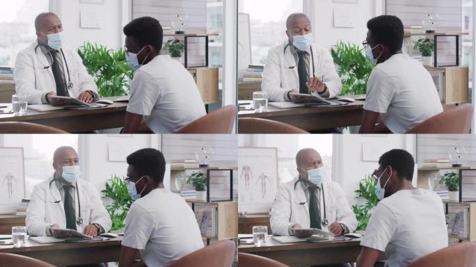 一名男医生在诊所的办公室与患者进行咨询的镜头