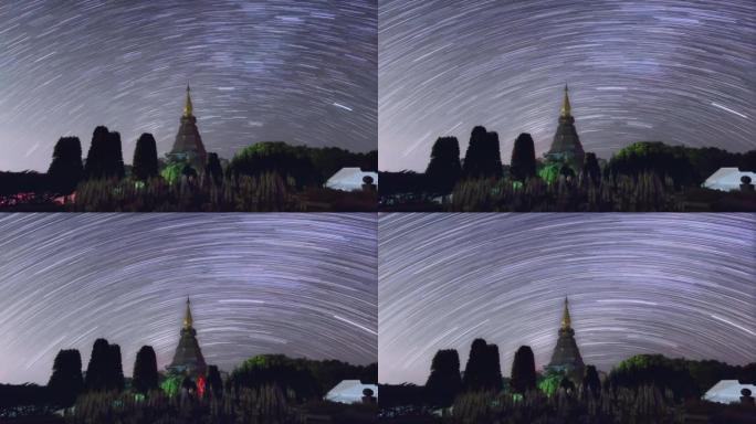 延时4K的星光轨迹移动在一个神圣的寺庙在Doi Inthanon国家公园，泰国清迈。黑夜从黑夜转到白